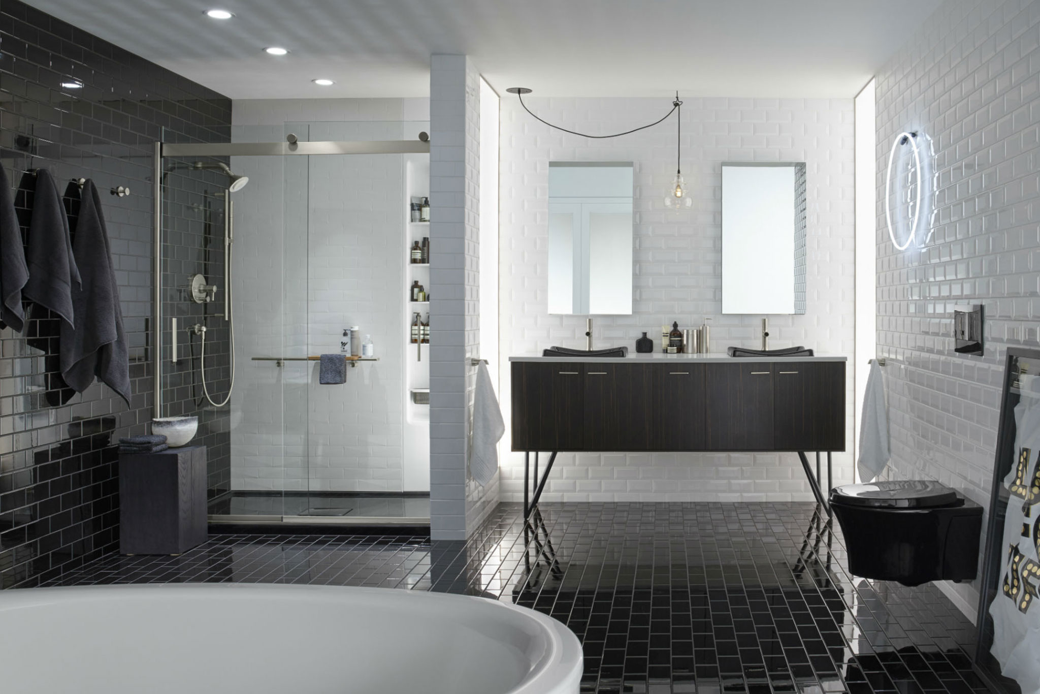 Bathroom with white tile walls and black tile floor
